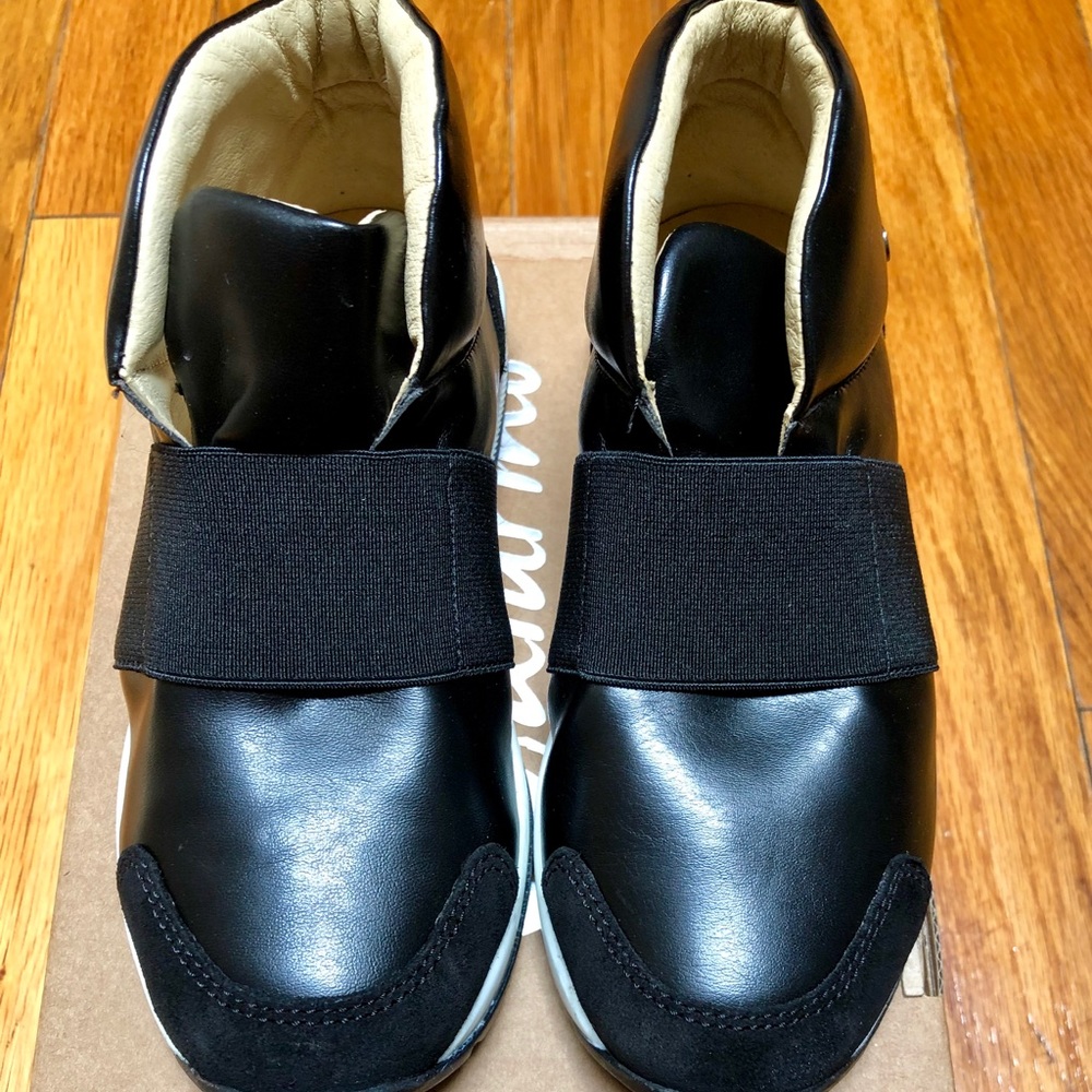 BNIB black slip on shoes. Hits ankle.